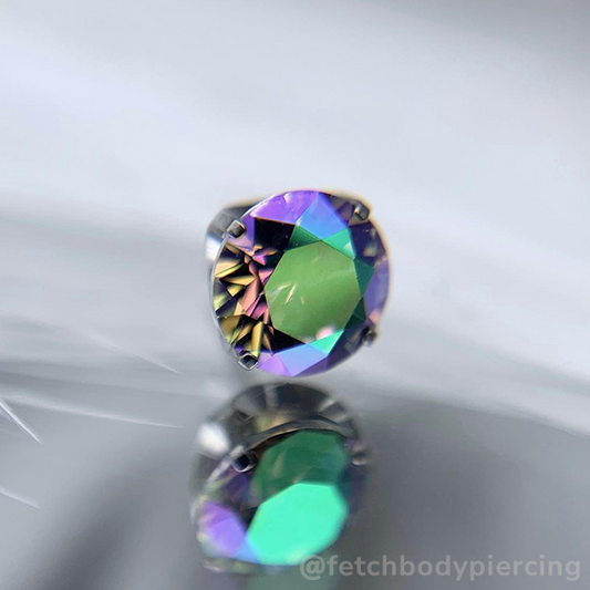 Seven sizes of threadless titanium prong set gem ends with cubic zirconia gems.