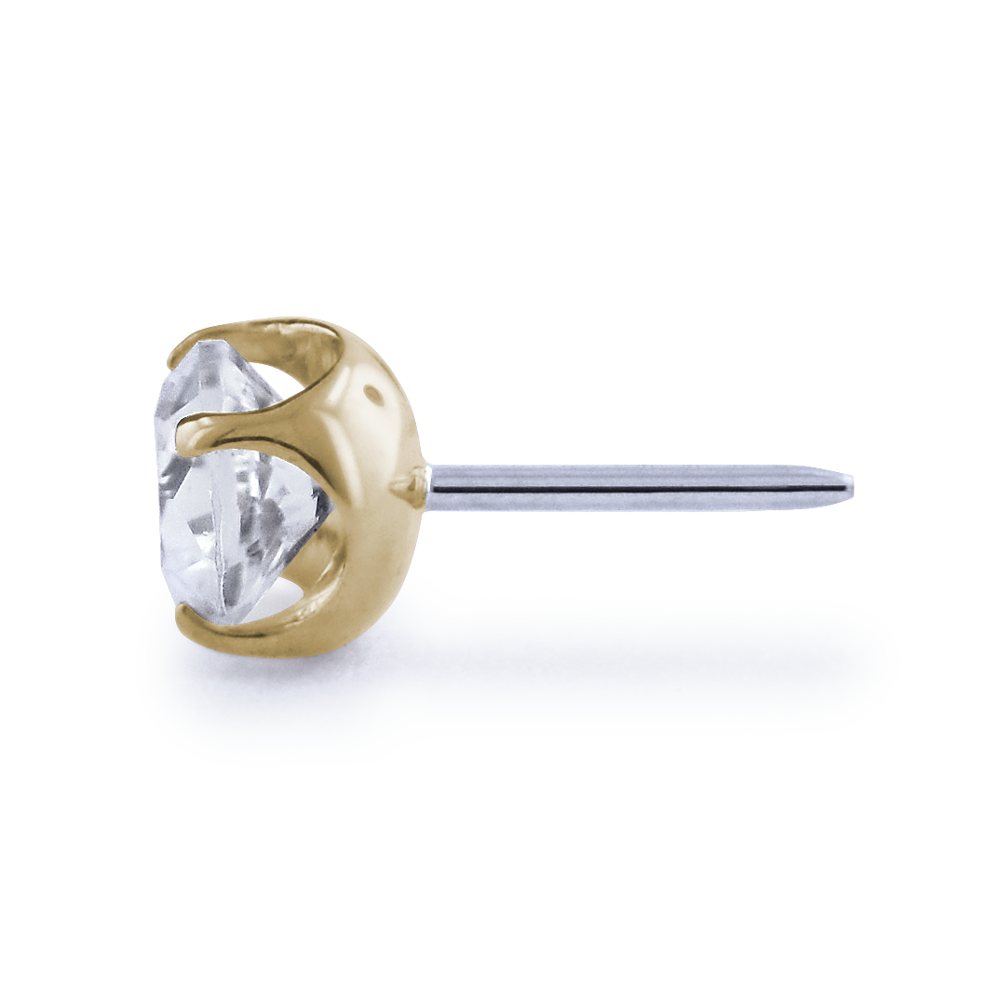 side profile of 18K yellow gold prong setting with a cubic zirconia gem