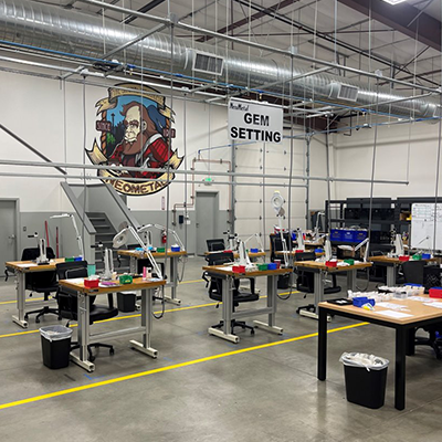 Multiple desks set up for use in the gem setting process