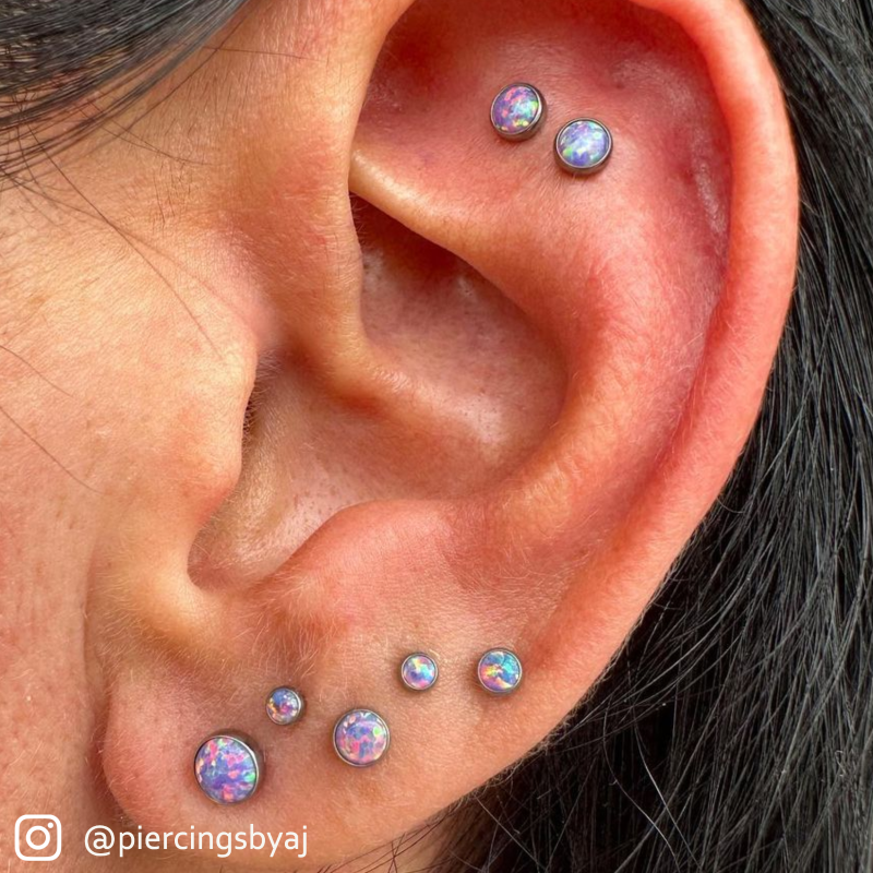 Multiple threadless titanium bezel set cabochon gem ends in ear