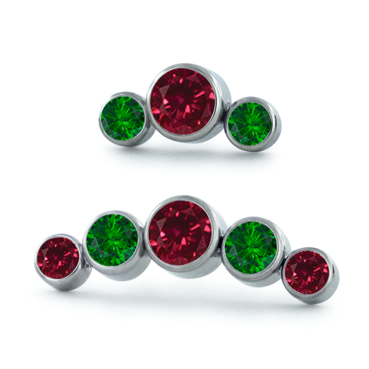 A 3-Piece and 5-Piece Curver Titanium Bezel Set Gem Cluster featuring Emerald and Ruby Faceted Gems