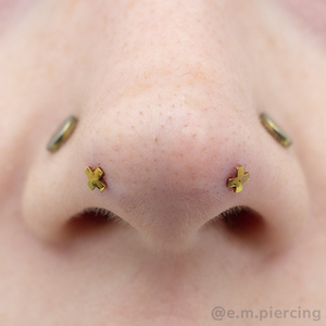 Mantis piercing with yellow anodized 'X' ends