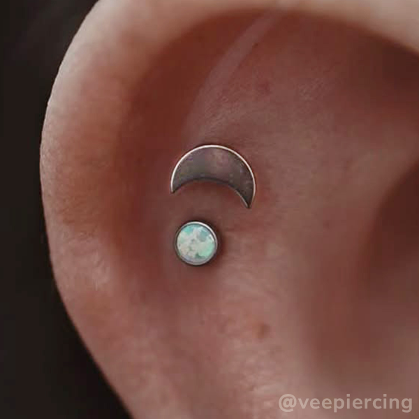 Titanium moon in helix piercing