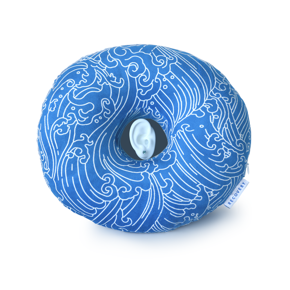 Blue Piercing Pillow with white wave outlines and simulated ear