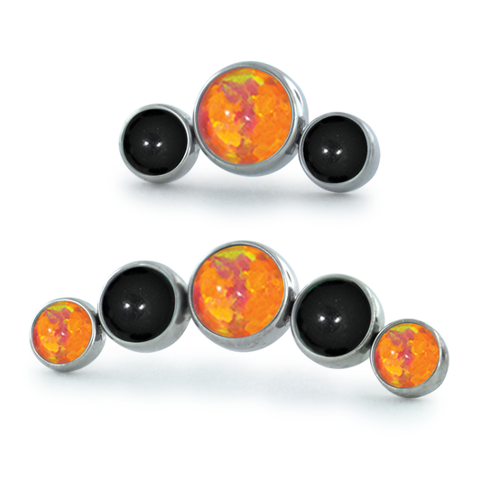 A 3-piece and 5-piece titanium curved cabochon cluster with onyx and orange cabochons
