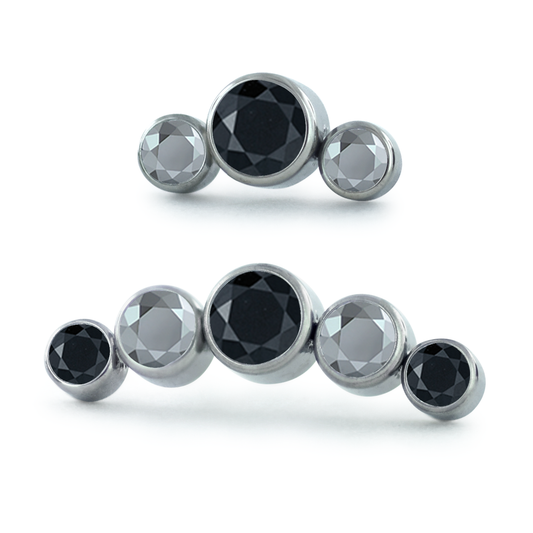 A 3-piece and 5-piece titanium curved cluster with light chrome and black gems