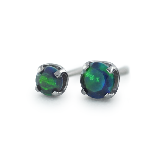 Two sizes of Faceted Black Opal Gems in threadless titanium prong settings