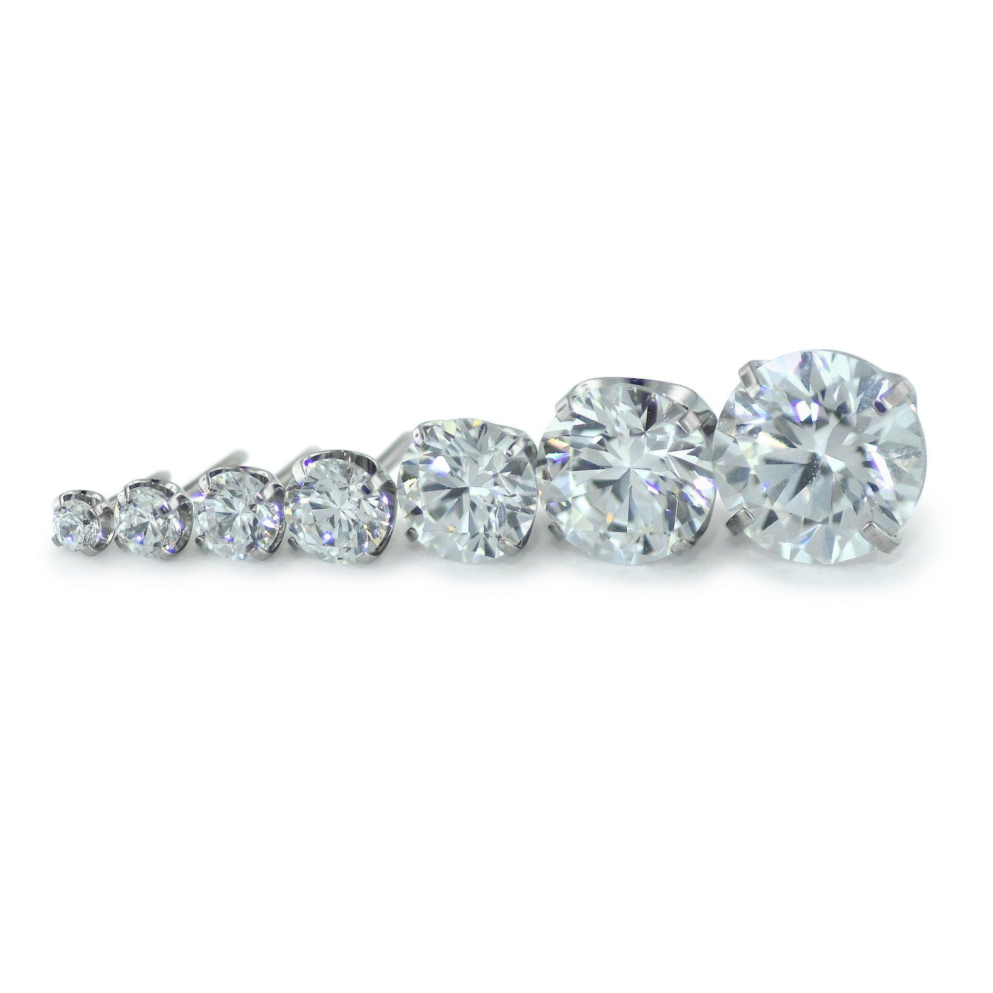 Seven sizes of threadless titanium prong set gem ends with cubic zirconia gems.