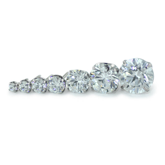 Seven sizes of threadless titanium prong set gem ends with cubic zirconia gems.