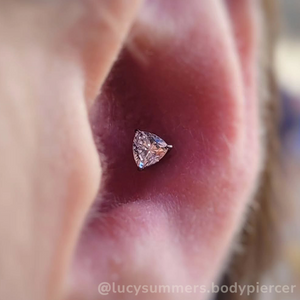 trillion cut prong set gem in conch piercing