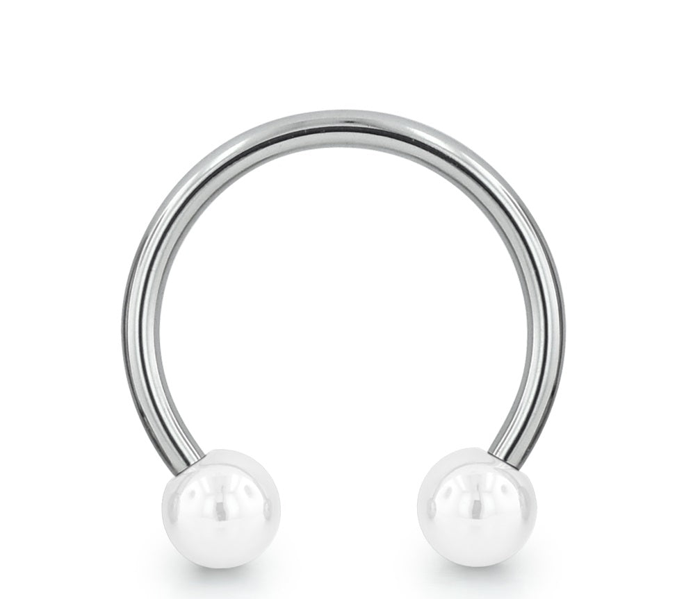A threadless titanium circular barbell with titanium ball ends thumbnail image