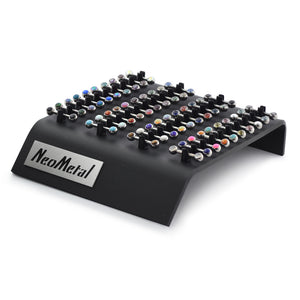 A 40 piece acrylic display case with the NeoMetal logo and versi-clip grips. The versi clips hold threadless titanium nipple bars with a variety of colored gem ends.