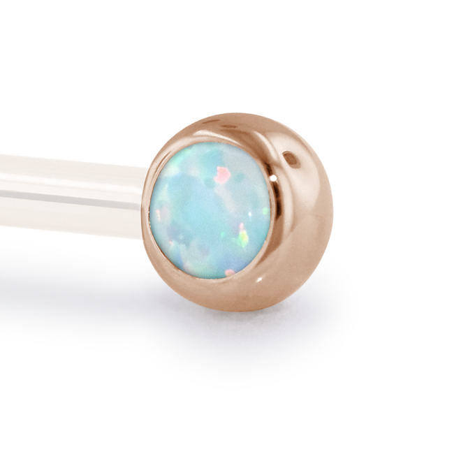 A 12 Gauge side gem in Rose Gold with a White Opal Cabochon