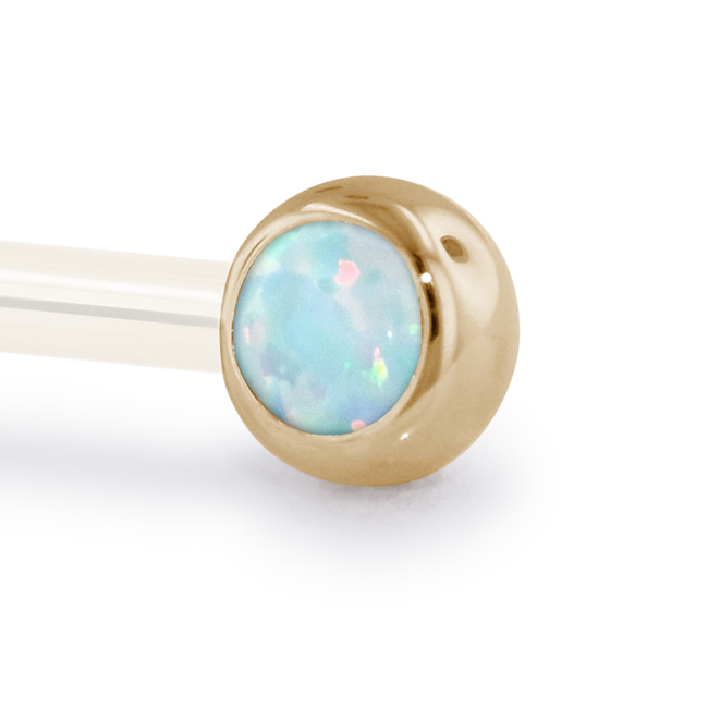 A 14 Gauge side gem in Yellow Gold with a White Opal Cabochon