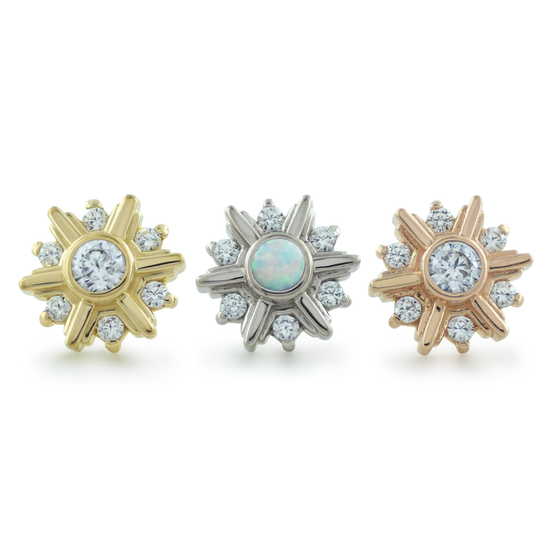 18K yellow gold, white gold, and rose gold settings with a cubic zirconia or white opal center gem surrounded by 6 smaller cubic zirconia gems