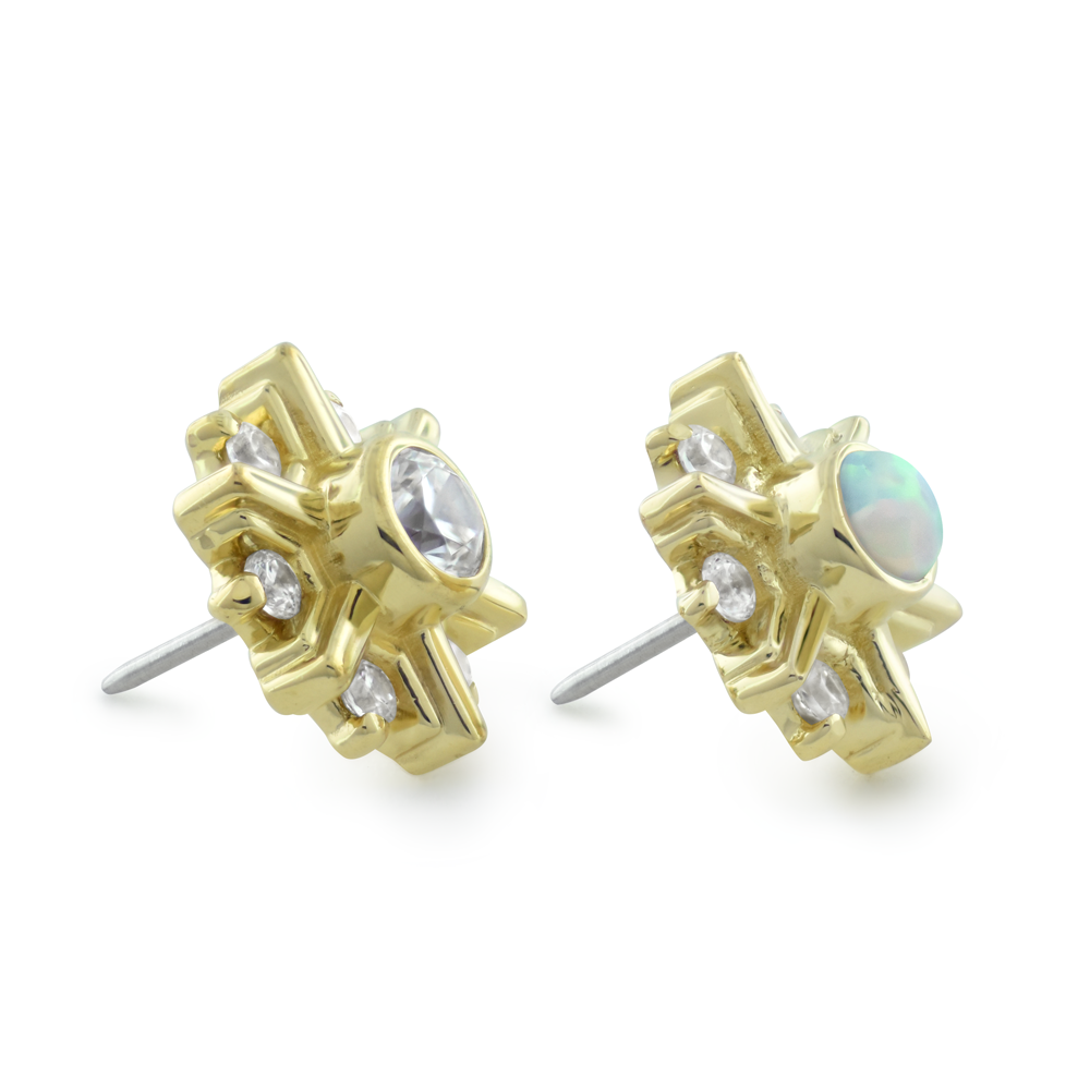 Side profile view of 18K yellow gold, white gold, and rose gold settings with a cubic zirconia or white opal center gem surrounded by 6 smaller cubic zirconia gems