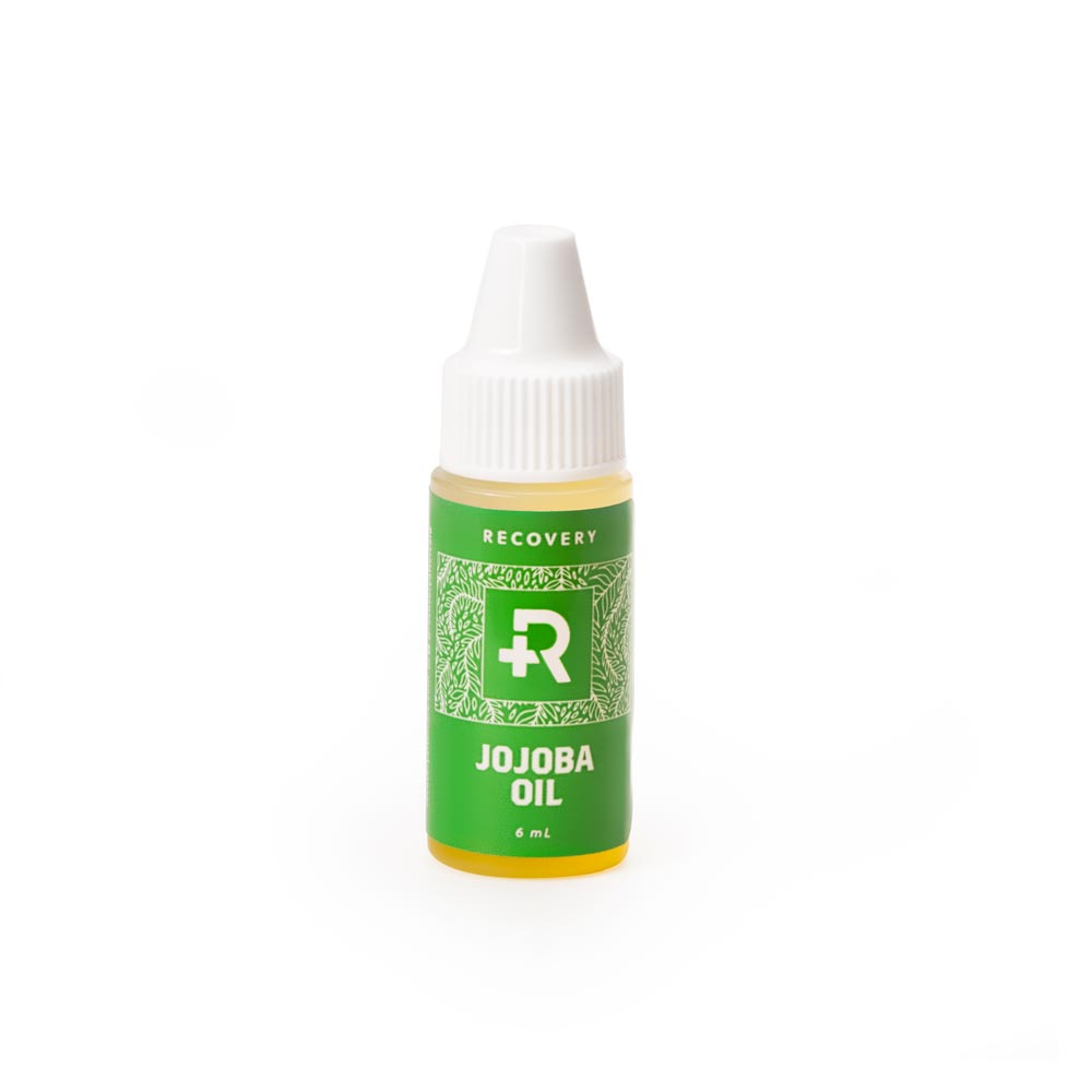Front of a Recovery Jojoba oil bottle