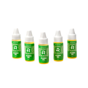5 Recovery jojoba oil bottle in a row