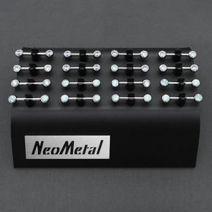 A 16 piece black versi clip display with nipple bars featuring Cubic Zirconia and White Opal Side Gems