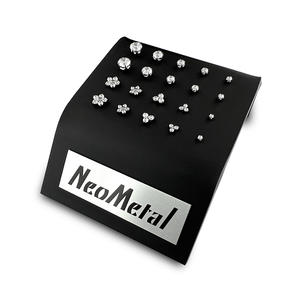 A 20 unit black display case showcasing different sizes of our titanium prong set gem ends with cubic zirconia and different sizes of our titanium flower and trinity gem ends with cubic zirconia