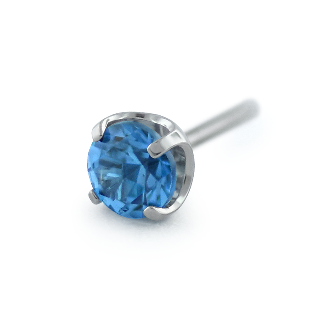 A Blue Zircon faceted gem in a threadless titanium prong setting
