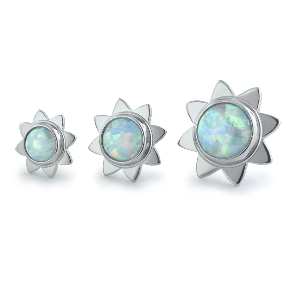 Three sizes of threadless titanium sun cabochons with white opal cabochons