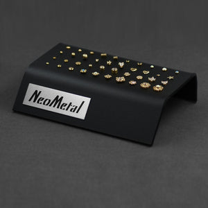 A 40 piece clear acrylic display case with the NeoMetal logo and a variety of gold gem ends.
